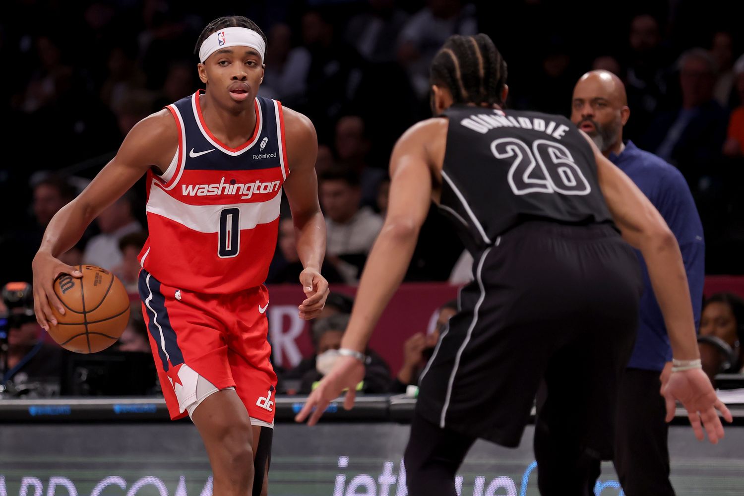 Dec 8, 2023; Brooklyn, New York, USA; Washington Wizards guard Bilal Coulibaly (0) controls the ball against Brooklyn Nets guard Spencer Dinwiddie (26) during the fourth quarter at Barclays Center.
